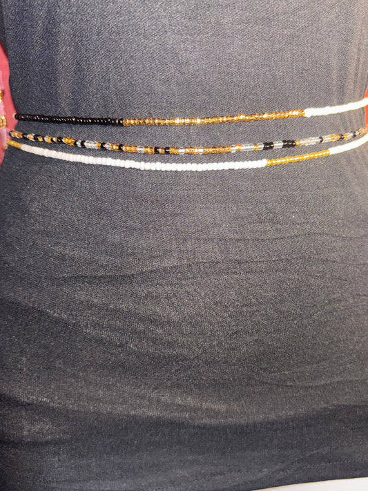 Handcrafted layered waist beads stacked on a natural waist